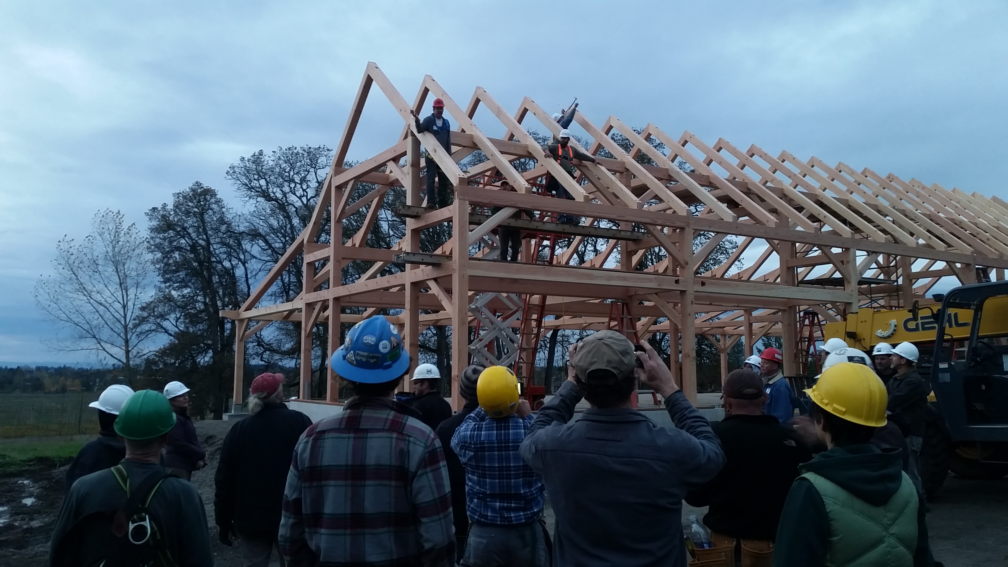 The final speech full of thanks and followed by attaching the pine bough and a thoughtful grace at the completion of the raising.