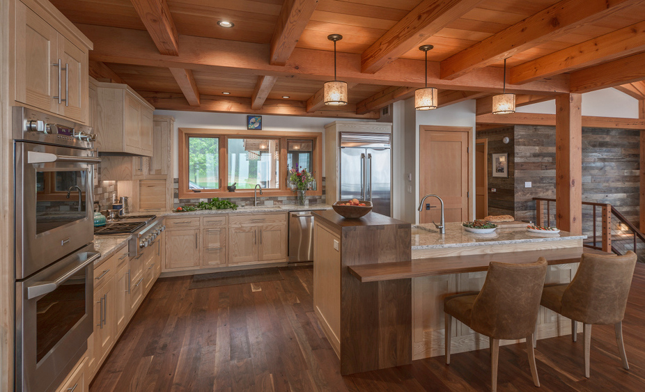 A “waterfall” of walnut flows over the bright Ash of the Olsen’s kitchen island.