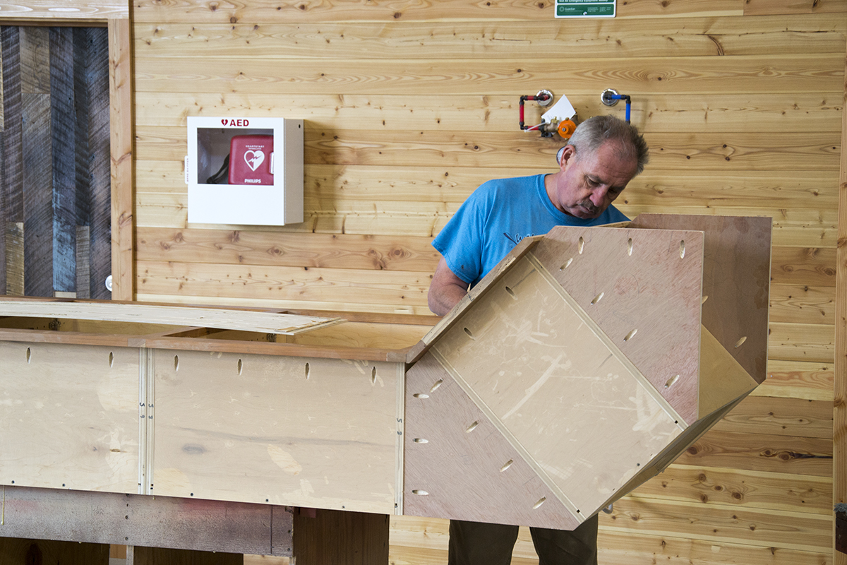 Gediminas works on the upper cabinets for the break room. Yes, our cabinet makers made their own cabinets.