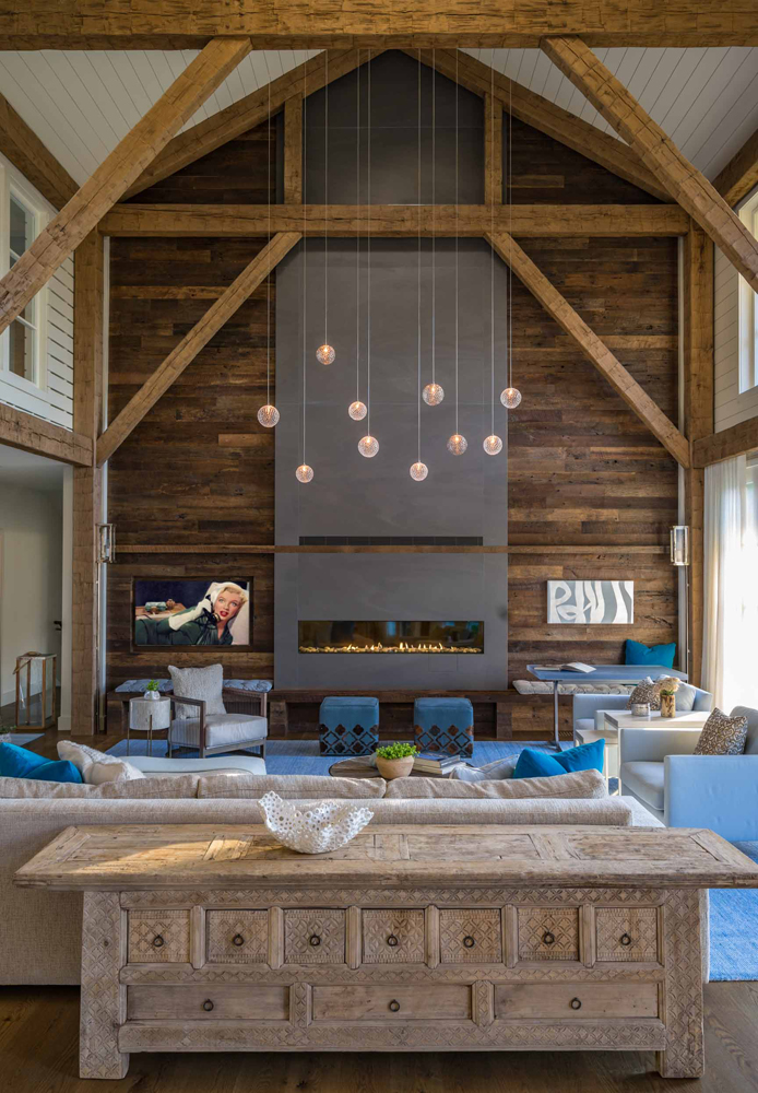 Applied hand-hewn timbers with a custom stain in this Massachusetts home. Photo: Eric Roth Photography.