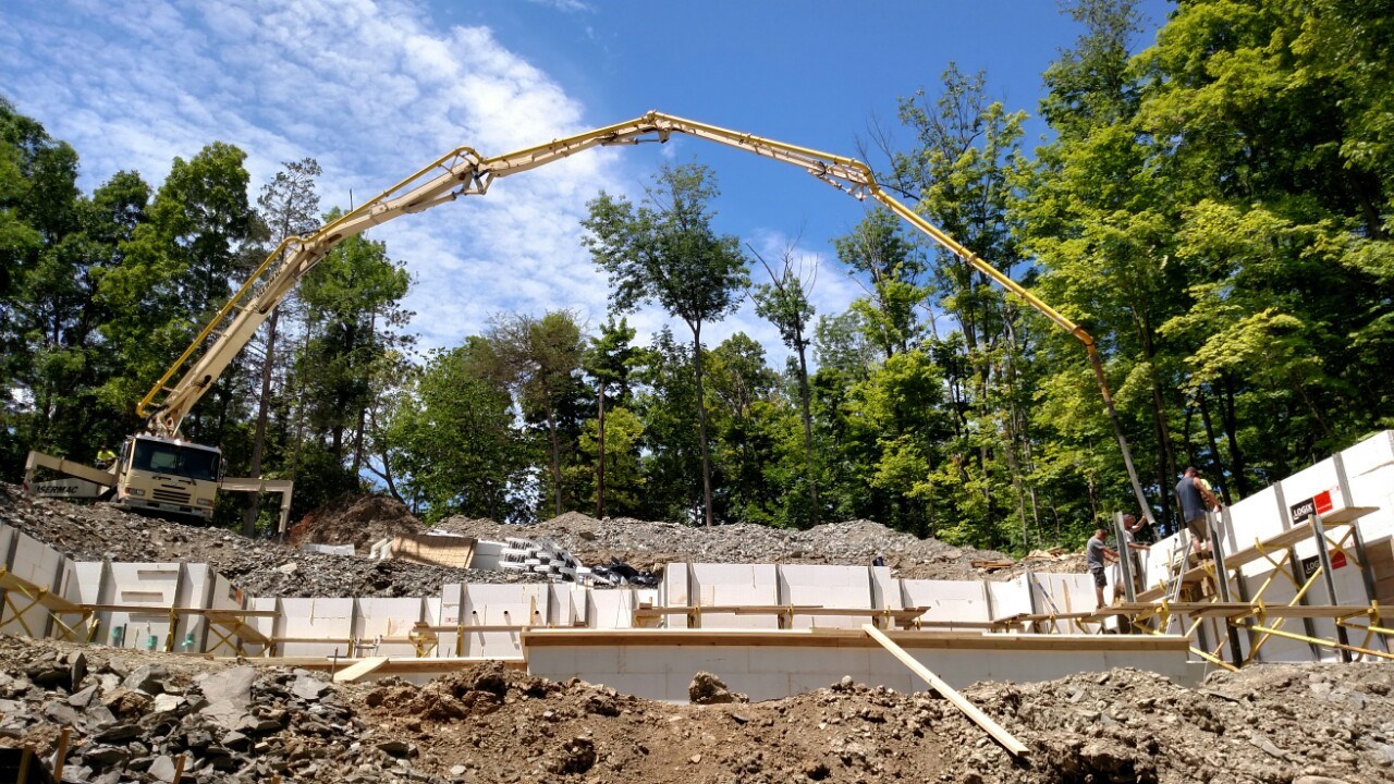 The home is set into the land, a part of the hillside. ICFs were used for the foundation and here are filled with concrete.
