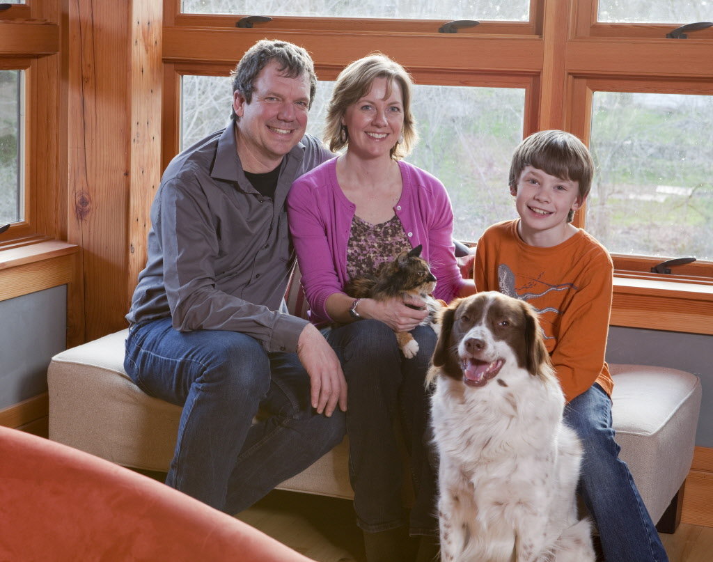 Jonathan Orpin, Maxine Bromfield (with Annie) and their son, Jake Orpin (with Dexter) moved into their home at the end of 2009 and feel now as if they are getting in the rhythm of the house, using and enjoying what each space offers. Photo by Stephen Cridland
