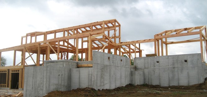 On a stormy day the frame was raised for our Lone Jack couple’s Missouri timber frame home.