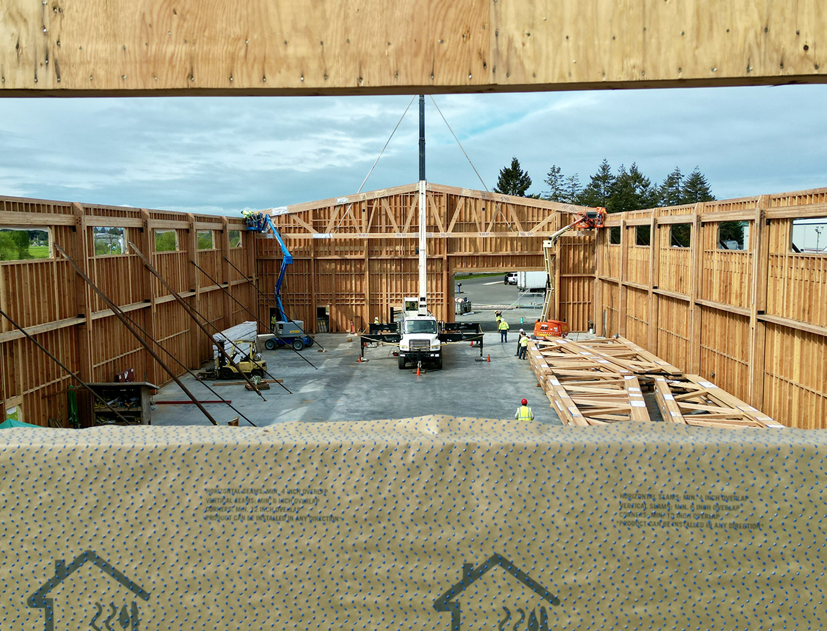 Light Commerical Glulam Trusses being rasied at New Energy Works NEWBeamery Project in McMinnville, OR