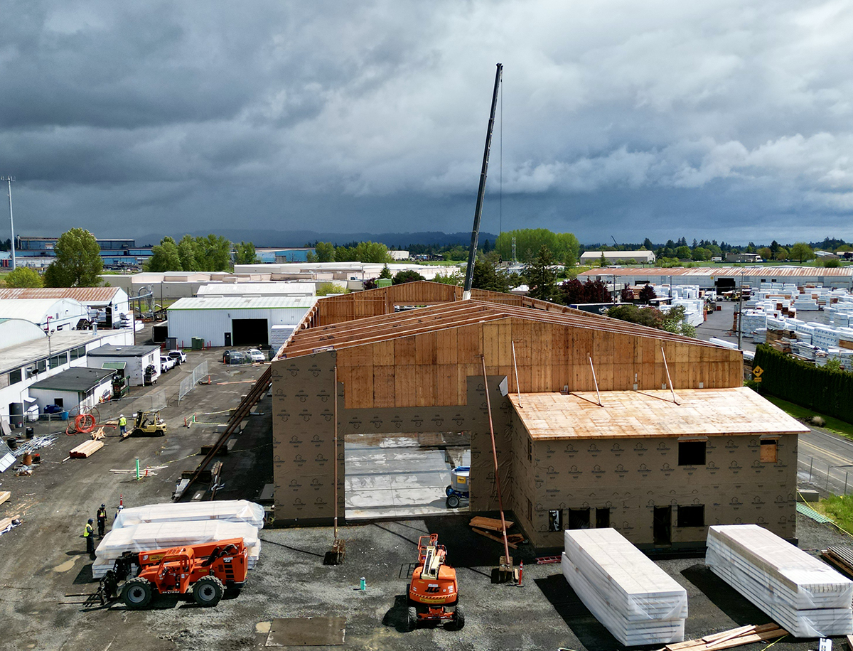 Light Commerical Glulam Trusses being rasied at New Energy Works NEWBeamery Project in McMinnville, OR
