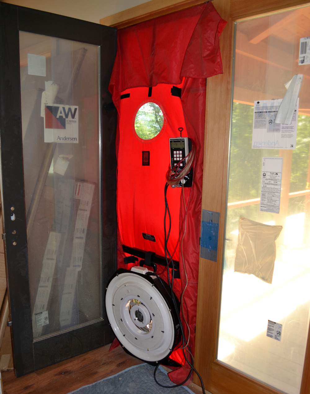 “Typically, we would do an initial blower door test when the building envelope is complete, before insulation and air-sealing. After the insulation is installed, and the obvious leaks in the envelope addressed, we would test again. Finally, we do the last check when the construction is finished [pictured above]. We are excited to see how our initial blower door test goes for the Allen’s Point project!”