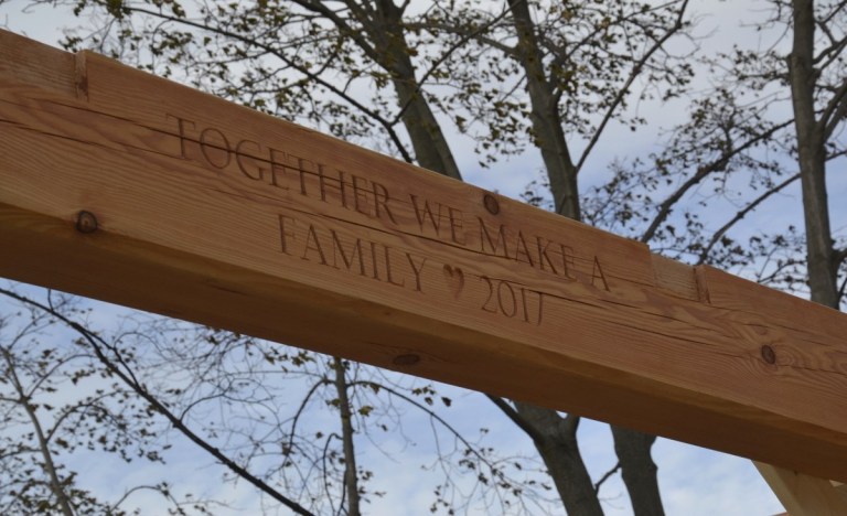 We particularly enjoyed carving the heart shape for this custom engraving on one of the frame’s central timber beams.