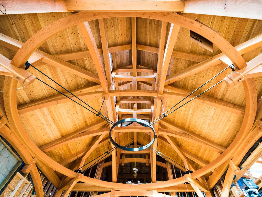 A combination of solid, glulaminated and grain-matched curved timbers, and integrated steel with multiple arched brackets and bracing exemplify the ‘circle in a square’.