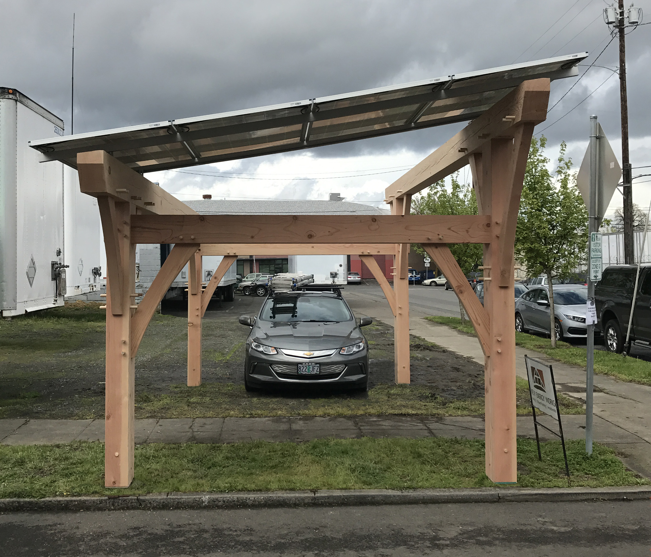 4 solar panels atop Douglas fir timbers