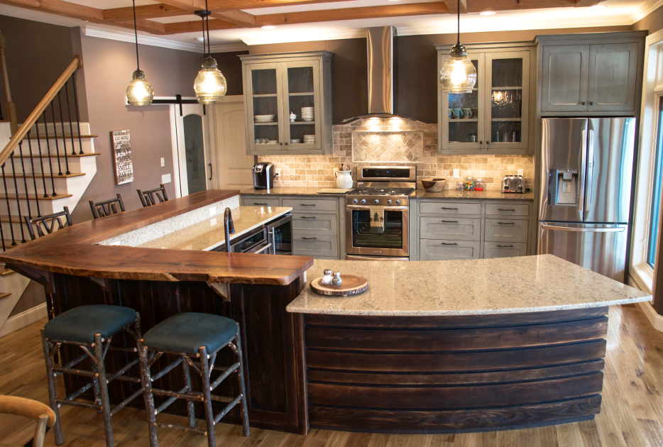A split level island puts wood where the elbows are using live-edge walnut atop reclaimed “toasted” oak.