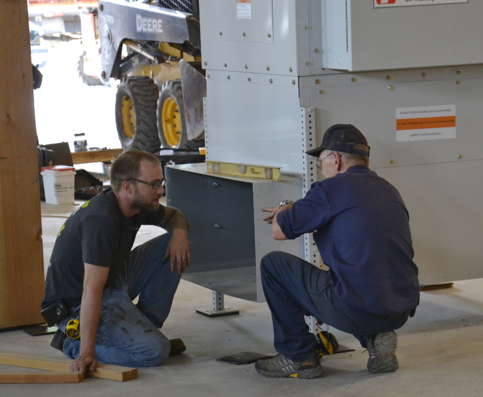 Ed and Steve talk connections for the dust collection ducts.