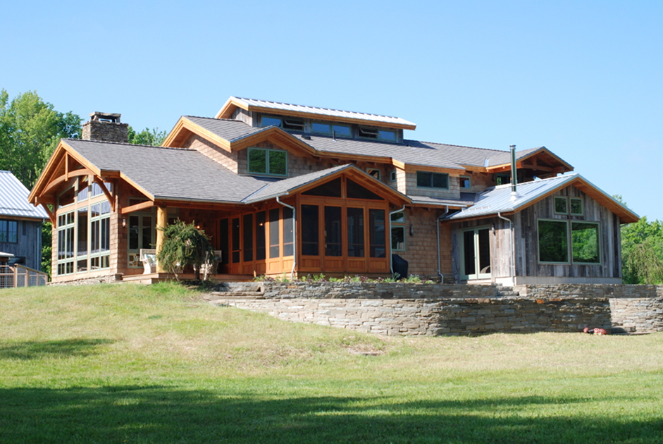 Dan and Beth’s timber frame home in Honeoye Falls, NY features a broad and detailed expanse of stonework, from the chimney to this back patio. The combination of natural wood and stone materials create inviting spaces, inside and out.