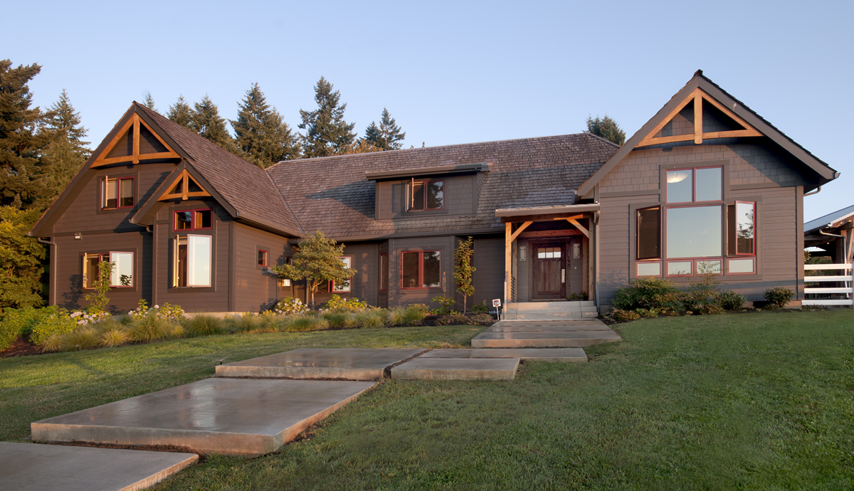 The exterior of Daniel and Sheri’s 1980’s timber frame had a face lift including re-working large windows, re-forming the main entry, and updating cladding.