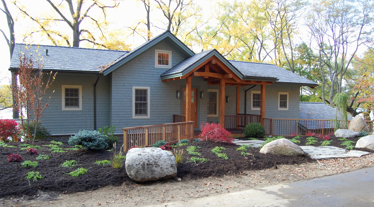 In keeping with local vernacular, the road side facia of this cottage home is modest and welcoming.