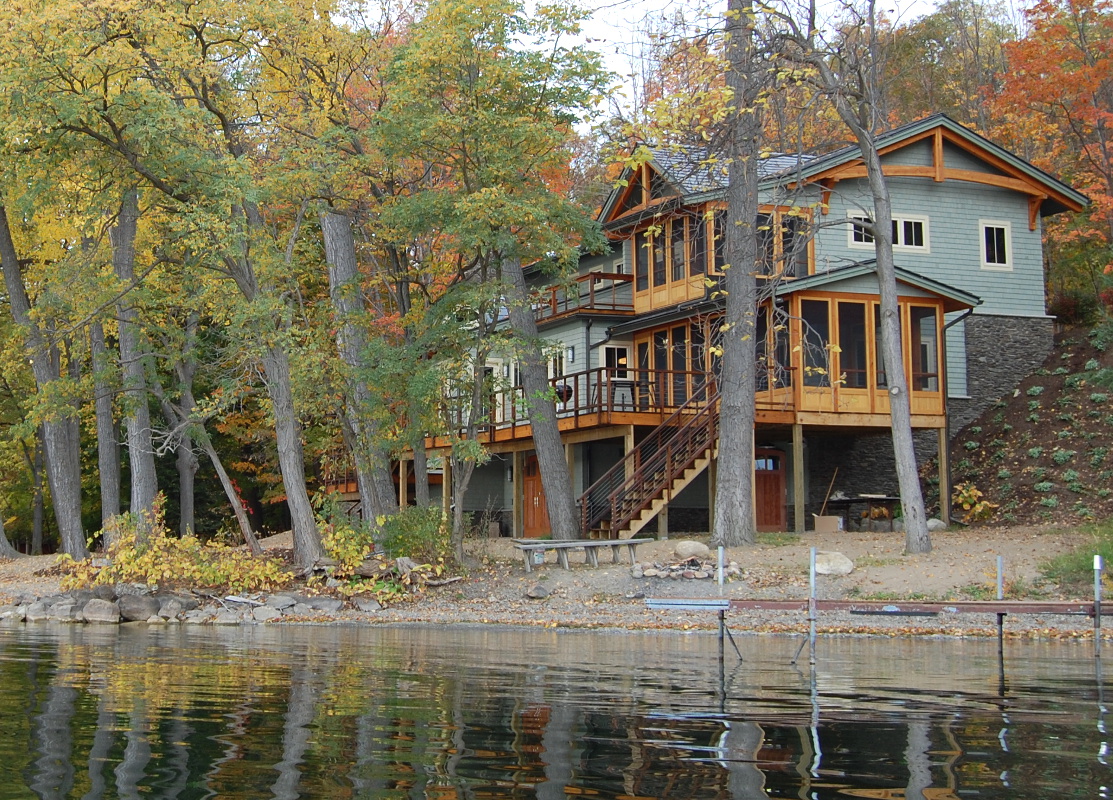 Multiple level screened porches and an open deck help the family make the most of lake living.