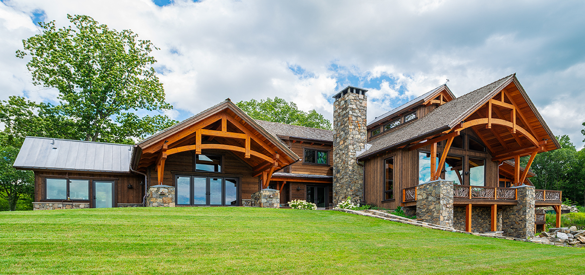 Transom windows express the Northeast vibe but are combined with big expanses of glass reminiscent of western mountain homes.