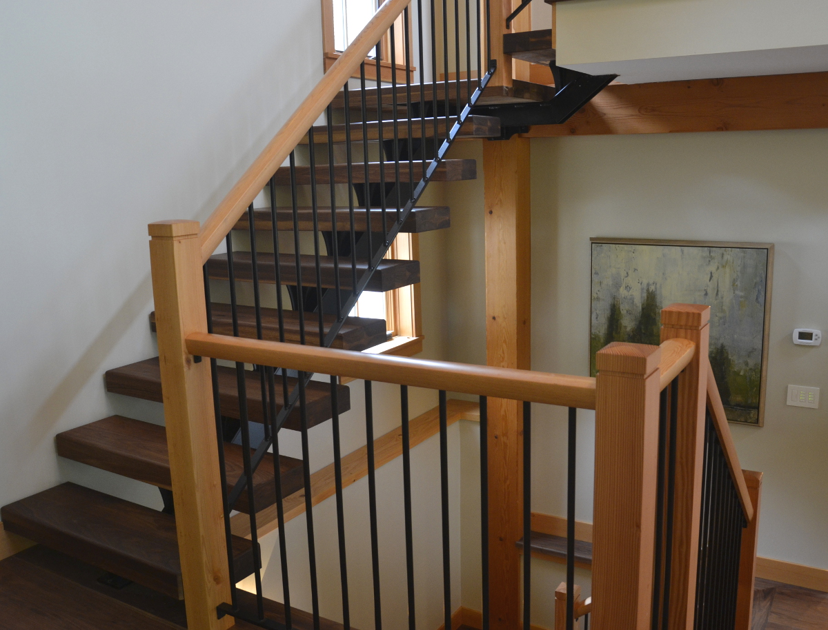The atrium space where this stair lives is tall, open, and bright. “We wanted to maintain the light and airy feel,” Ty continues, “The minimalist style of the stair reduces its importance as an architectural element and gives authority to the overall design.”