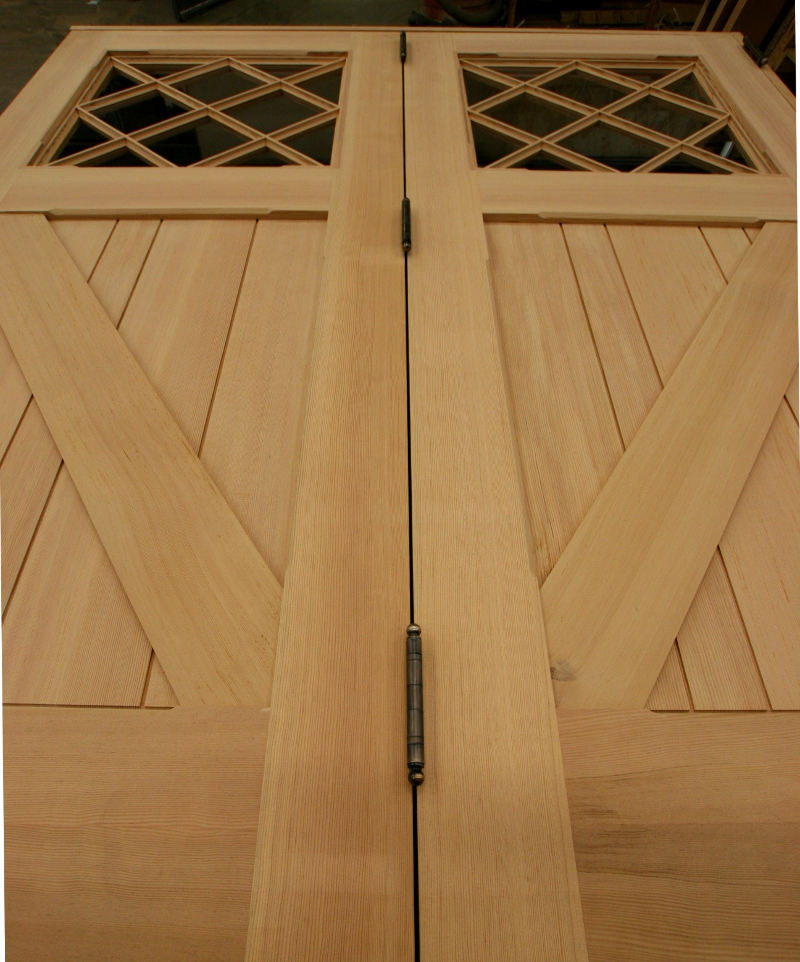 Large folding barn doors await finishing touches in the NEWwoodworks shop.