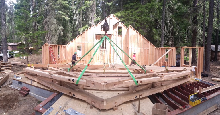 A pre-assembled timber bent, strapped and ready for raising.