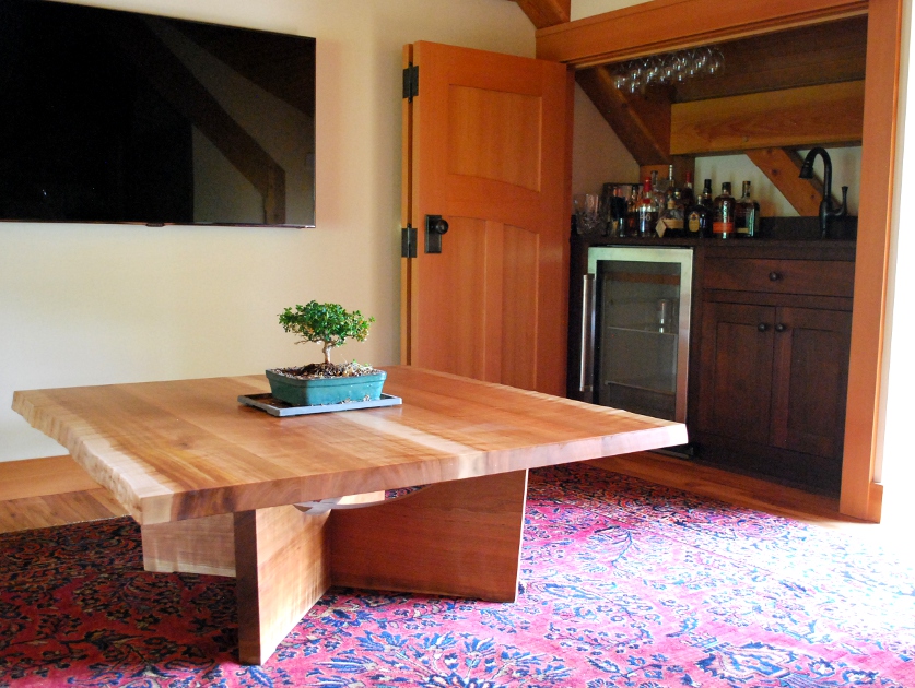 Figured cherry maintains a live edge with a low height traditional for coffee tables.