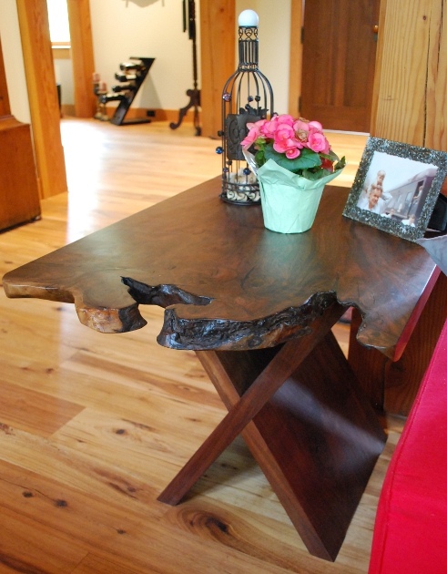 Similar to the dining table, walnut end tables have one-of-a-kind live-edges in this Kentucky home.