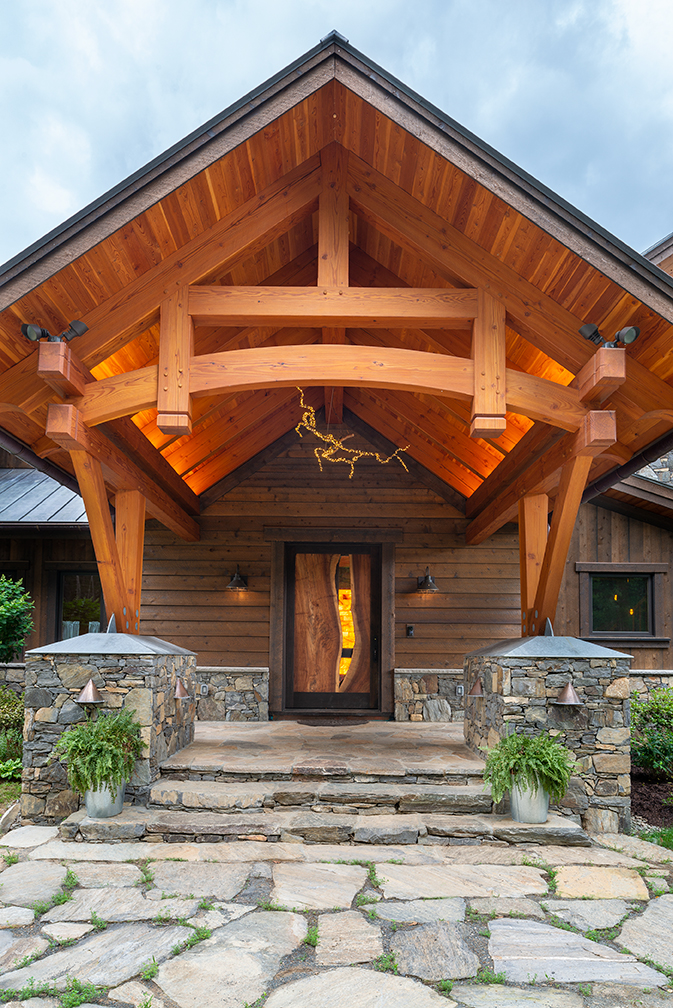 The main entry introduces visitors to the wood, stone, and steel elements that are integrated throughout the home.