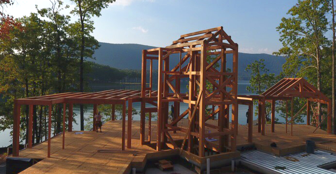 The timber frame “mine shaft” effect includes heavy cross members within the stair and elevator shaft.
