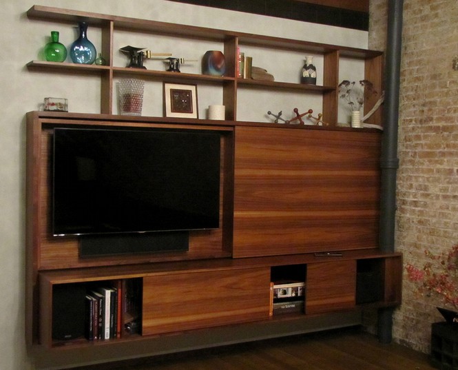Floating, sliding, open, unembellished, clean grained–this custom entertainment center tucked into a modern city loft is all about mod.