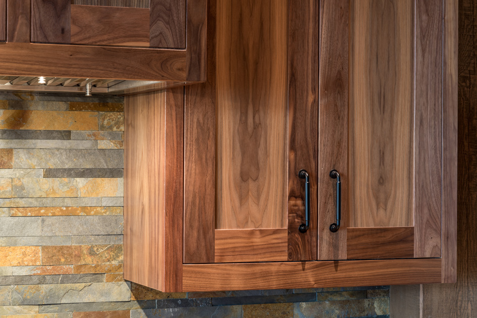 Custom walnut kitchen cabinetry, crafted by NEWwoodworks.