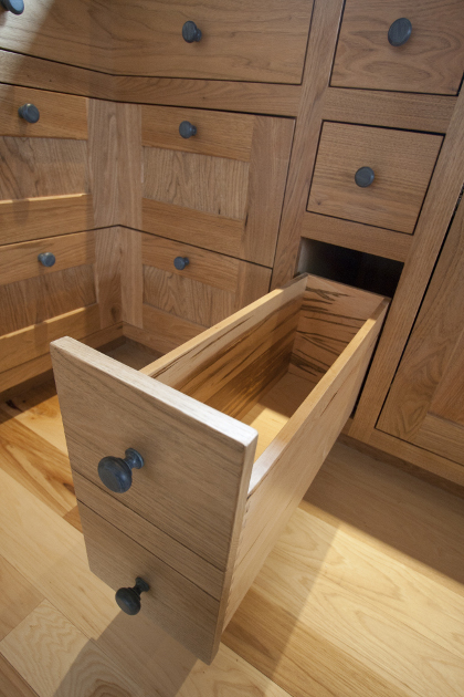 Dan and Beth’s custom kitchen cabinetry, crafted of Butternut, includes corner drawers and faux double drawers all with Blum hardware.
