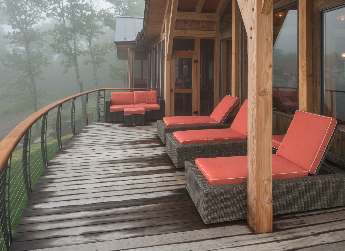 Exterior railings hint at the decor inside the Olsen family timber frame home.