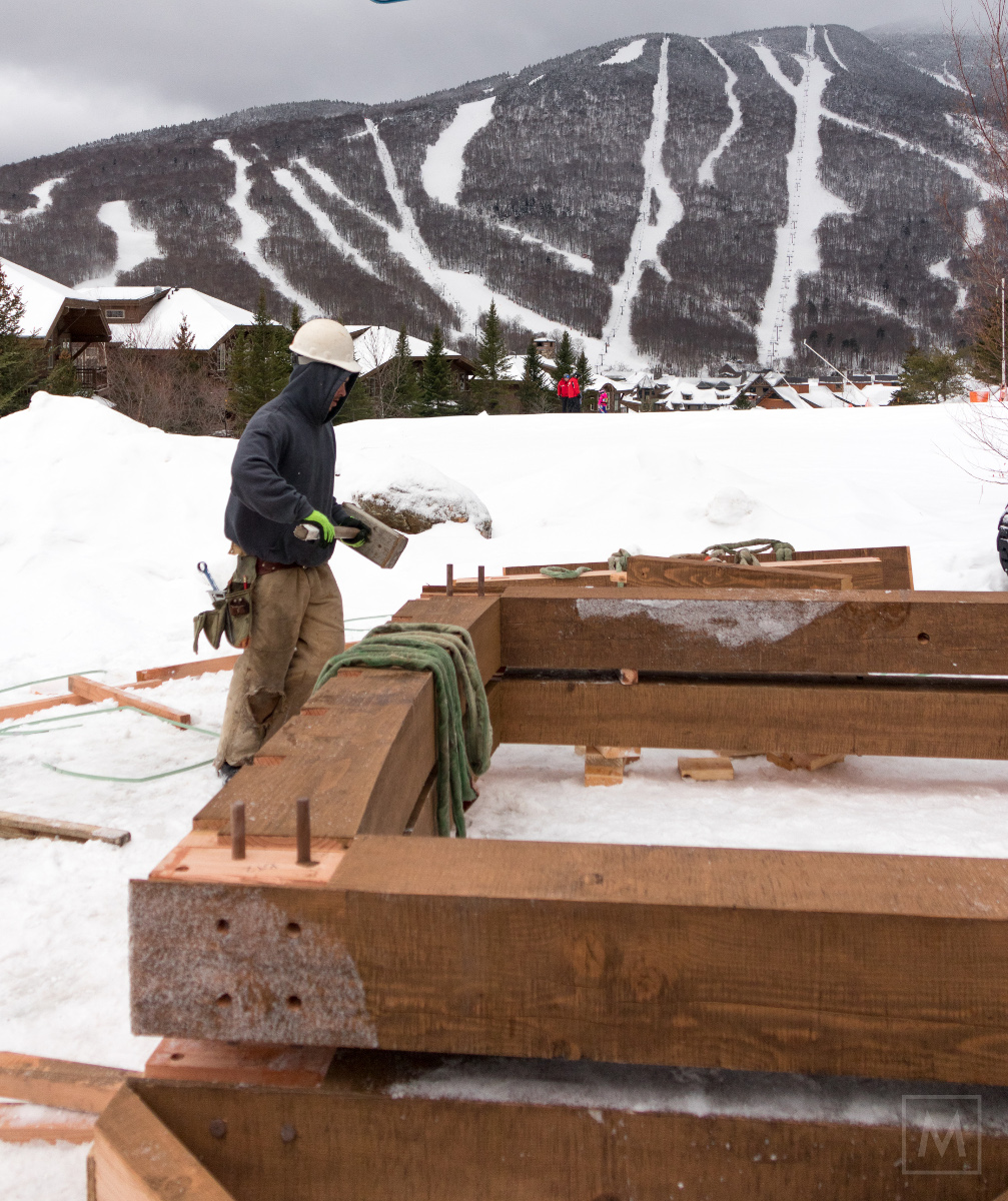No stranger to the beetle, long-time timber frame craftsman Paul drove a few pegs home while pre-assembling one of the custom finished bents.