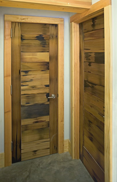 Interior doors, crafted from reclaimed vat stock celebrate signs of previous life.