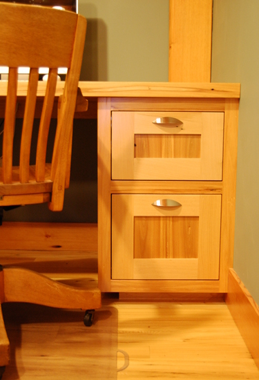 Reclaimed beech flows from drawer to drawer in this custom desk. A good example of how tracking each plank allows for flowing, creative woodworking.
