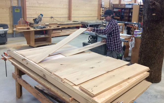 Reclaimed oak lamellas over a torsion box with a stave core for an exterior entry door.