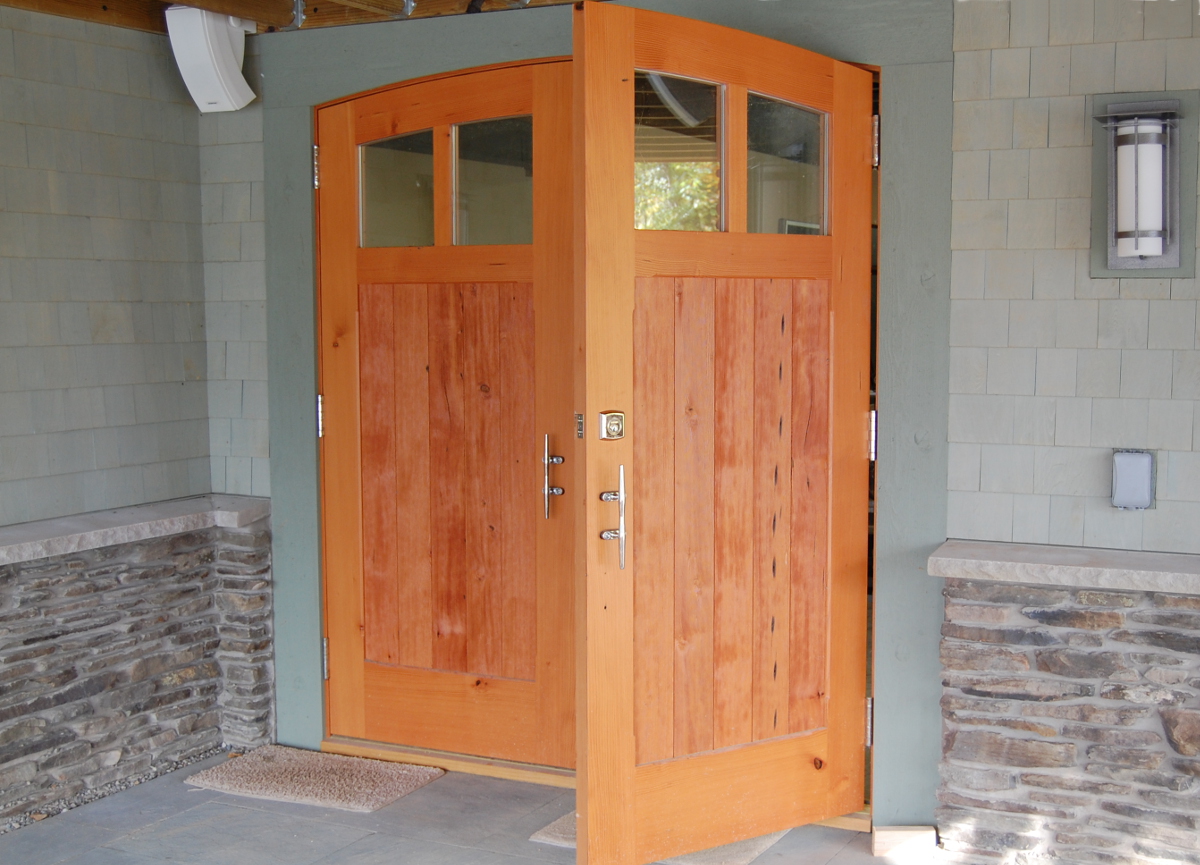 Reclaimed Knotty’n’Naily Douglas fir, celebrated throughout this home, adds character to the double storage doors crafted by NEWwoodworks.