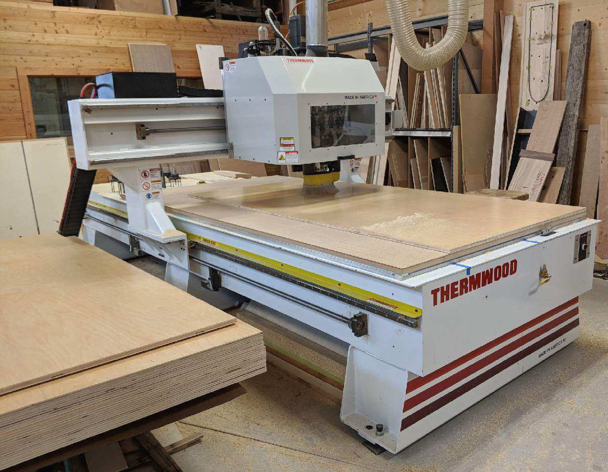 Stepping up NEWwoodworks already notable capabilities is “Thelma”, a Thermwood CNC MTR-30 5×10 3-axis router. Much of their work is done with reclaimed timbers and board stock so a raised z-axis to accommodates the larger timber stock, additional table reinforcement and stiffer axes to aid in cutting denser material and an upgraded vacuum table to make complex jigging and complicated hold-downs easier and faster are all incorporated into the CNC.