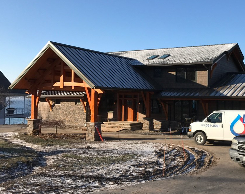 Rotating the roof lines to present a gable end on the roadside facade redefined the car port as a focal point while maintaining function.