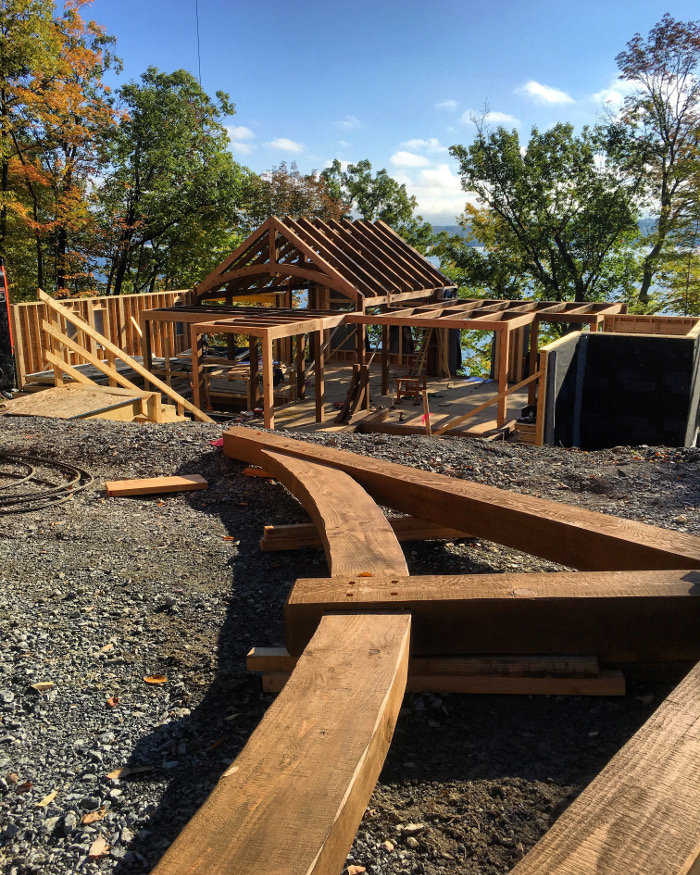 A pretty lake view was enjoyed by the beetle, our co-workers, and timber frame fans during the raising. This project used Douglas fir with a custom textured/stained finish.