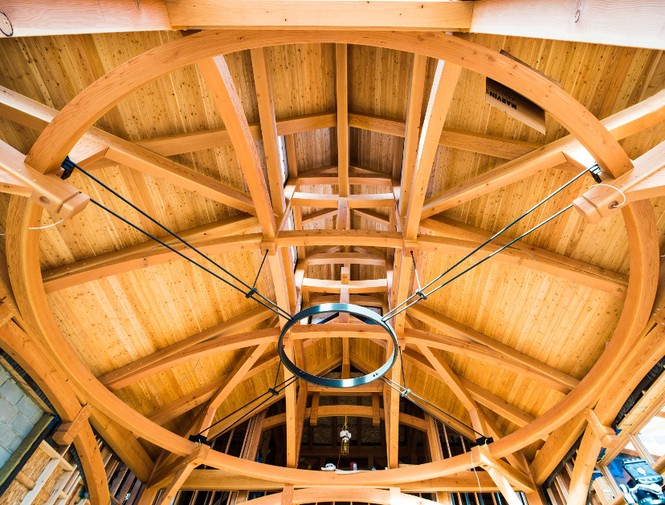 Grain matched glulams were essential to creating the “circle in a square” for the great room of a Connecticut home.