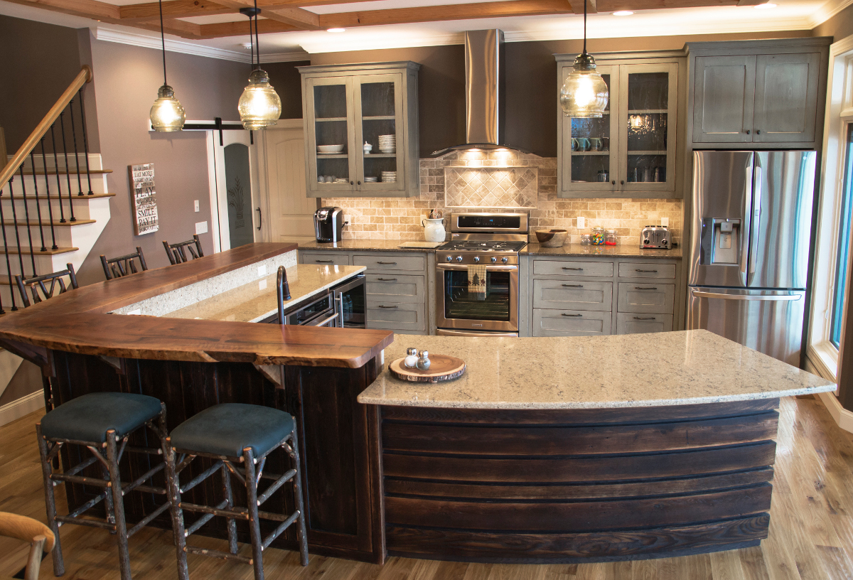 Reclaimed oak was ‘toasted’ to create a darker, more rustic island with custom finished painted reclaimed oak cabinets behind.