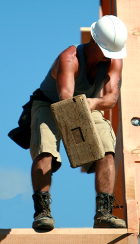 It takes a good bit of muscle to swing the beetle as Will demonstrates during a west coast raising. This view also shows the how the handle is driven through the head of the mallet for a friction fit, much like a pickaxe.