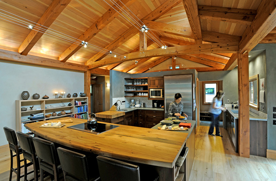 How cool is this house in Oregon that was built with reclaimed timbers?! (And that’s Jennifer in the kitchen.)