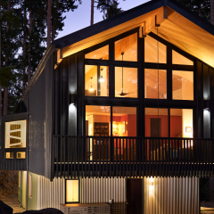 This mass timber home uses the material's inherent structural stability to achieve a cantilevered or "floating" design.