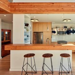 Engineered wood is not only a great solution for framing, but is a popular material for countertops and furniture. Used together, it really ties the room together.